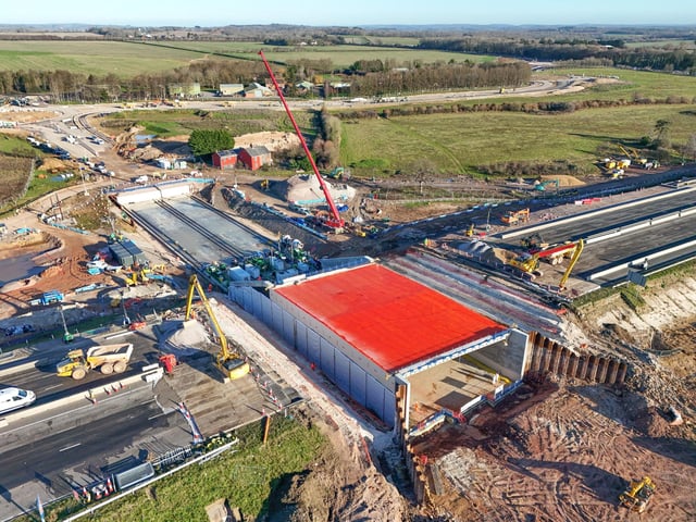 Pictured:  The large concrete structure, which is creating the underpass, has been pushed into the hole on the M27.