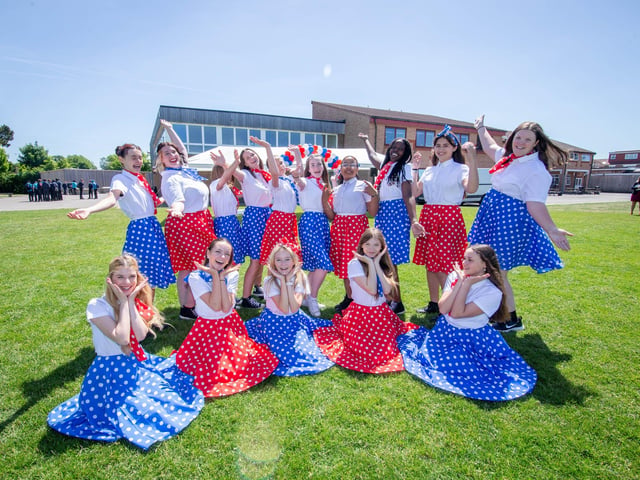 Dance students of Trafalgar School, Hilsea, Portsmouth celebrating outside their school