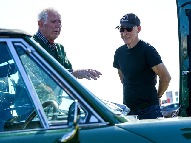 John Evans, left, and Bryan Hedges discussing Mr Evans' 1974 Triumph Stag.