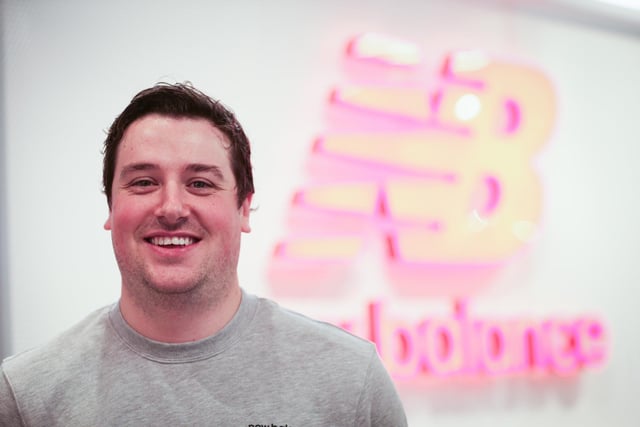 Store manager Eddie Warton at the New Balance shop opens in Gunwharf Quays, Portsmouth Picture: Chris  Moorhouse (271124-20)