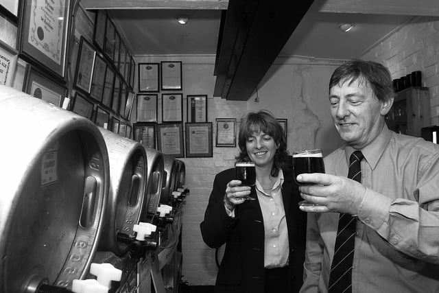 Gales Brewery at Horndean 3rd October 2003. Moyra Williams, packaging and trade quality brewer and Derek Lowe, head brewer, sample Sweet Chariot in the sampling room, complete with award certificates on the walls. Picture: David Garvey 033382-4