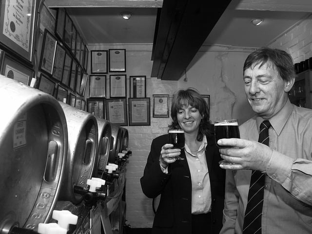 Gales Brewery at Horndean 3rd October 2003. Moyra Williams, packaging and trade quality brewer and Derek Lowe, head brewer, sample Sweet Chariot in the sampling room, complete with award certificates on the walls. Picture: David Garvey 033382-4