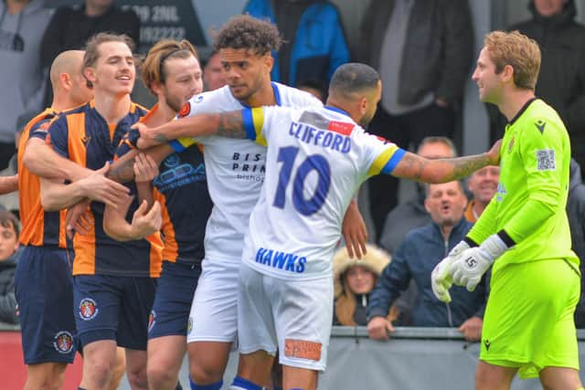 Hawks' Billy Clifford acts as peacemaker as tempers rise. Picture: Martyn White