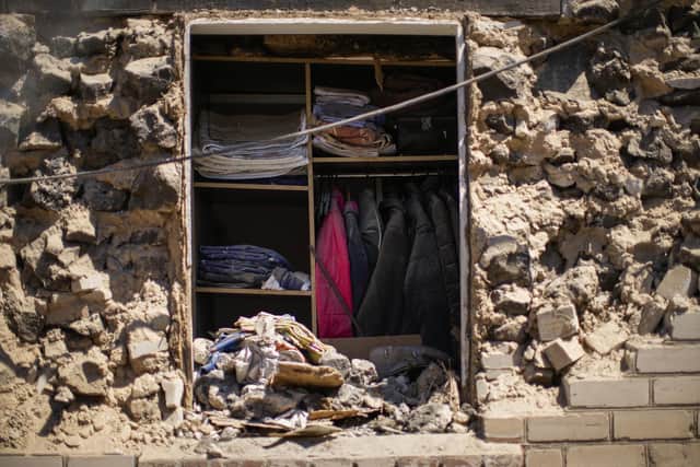 Clothes hung in a closet of a destroyed house after a Russian rocket, hit by Ukraine's anti-aircraft system, stroke in a residencial area in Zaporizhzhia, Ukraine, Thursday, April 28, 2022. Picture: (AP Photo/Francisco Seco)