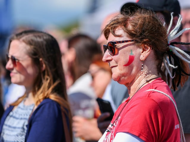 Onlookers watch one of the main events, the chilli eating contest.