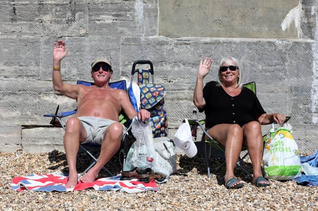 Mike Hazel and Jenny Harris enjoying the sunshine in Old Portsmouth.
Picture: Sam Stephenson.