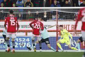 Liam Shaw scores for Morecambe.