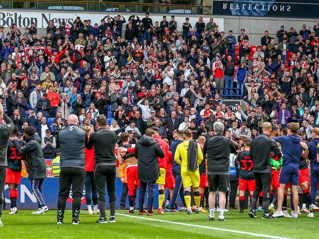 Fleetwood celebrate their League One survival with supporters at Bolton but it was a close run thing Picture: SAM FIELDING / PRiME MEDIA IMAGES