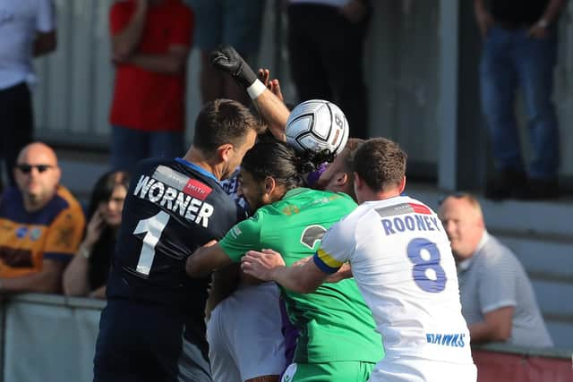 Hawks keeper Ross Worner goes up for a stoppage time corner towards the end of the home loss to Oxford. Picture by Dave Haines.