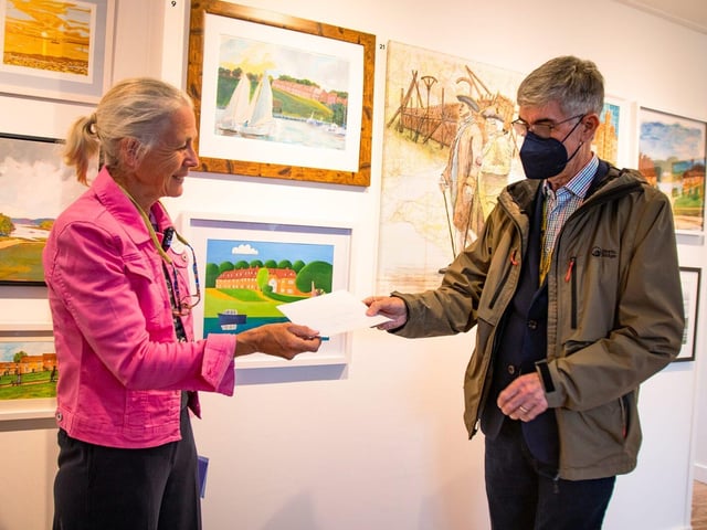 Mary Montagu-Scott presents Bernard Mathysse with his prize for winning third place
