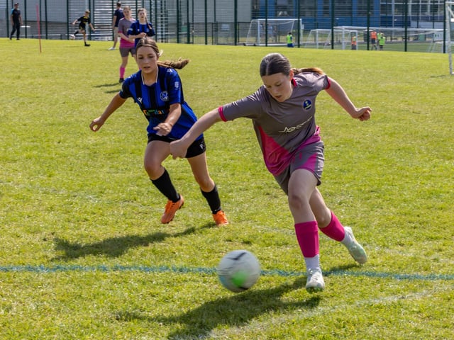 City Ladies (pink/grey kit) versus Clanfield Girls (blue) in the Clanfield youth football tournament at Horndean Technology College. Picture: Mike Cooter