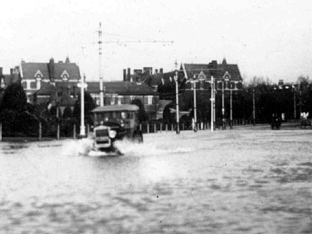 Flooding Clarence Pier Road some time between 1920-1930.Mrs Rita Wall of Southsea sent this image in. Flooding at the northern end of Pier Road at its junction with Gordon Road.In the background can be seen Victoria Barracks and to the right would be the Pier Hotel.