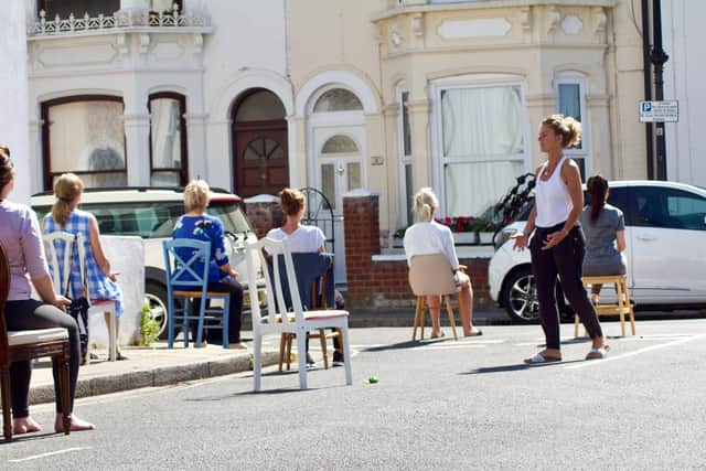 Maxine Bailey-Green leading socially-distanced yoga sessions in Wilton Terrace, Southsea. Picture by James Wileman