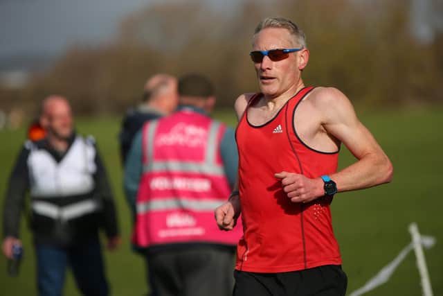 First man home James Baker had more than a five minute gap between himself and the next runner, and set a new course record at Great Salterns. Picture: Chris Moorhouse