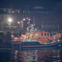 Over 100 illegal migrants aboard two RNLI lifeboats entered Portsmouth Harbour on Sunday evening just after 10pm, heading for Fort Blockhouse in Gosport, Hampshire where teams from the Home Office were there to welcome the migrants. They were then heading to board one of a number of buses waiting for them. They are pictured passing Fort Blockhouse.   Pictureexclusive.com