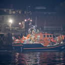 Over 100 illegal migrants aboard two RNLI lifeboats entered Portsmouth Harbour on Sunday evening just after 10pm, heading for Fort Blockhouse in Gosport, Hampshire where teams from the Home Office were there to welcome the migrants. They were then heading to board one of a number of buses waiting for them. They are pictured passing Fort Blockhouse.   Pictureexclusive.com