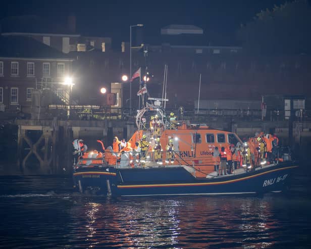 Over 100 illegal migrants aboard two RNLI lifeboats entered Portsmouth Harbour on Sunday evening just after 10pm, heading for Fort Blockhouse in Gosport, Hampshire where teams from the Home Office were there to welcome the migrants. They were then heading to board one of a number of buses waiting for them. They are pictured passing Fort Blockhouse.   Pictureexclusive.com