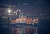 Over 100 illegal migrants aboard two RNLI lifeboats entered Portsmouth Harbour on Sunday evening just after 10pm, heading for Fort Blockhouse in Gosport, Hampshire where teams from the Home Office were there to welcome the migrants. They were then heading to board one of a number of buses waiting for them. They are pictured passing Fort Blockhouse.   Pictureexclusive.com