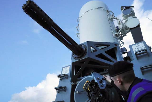 Pictured - Leading Engineering Technician (Weapons Engineering) Murton loading the Phalanx weapons system - on HMS Duncan in 2016.