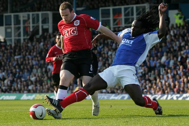 Wayne Rooney of Manchester United clashes with Linvoy Primus of Portsmouth during the Barclays Premiership match between Portsmouth and Manchester United at Fratton Park on April 7 2007. Picture: John Peters/Manchester United via Getty Images.
