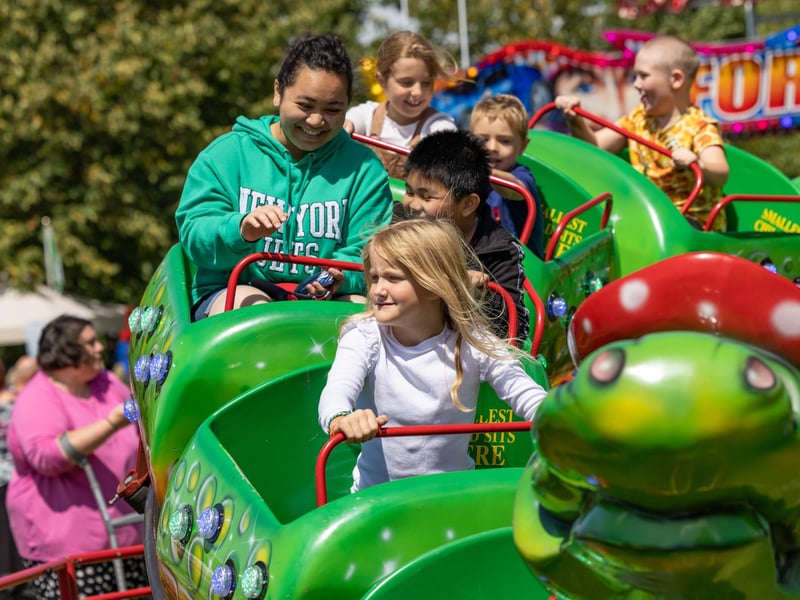 Enjoying the rides at the Party in the Park. 
Picture: Mike Cooter (290723)