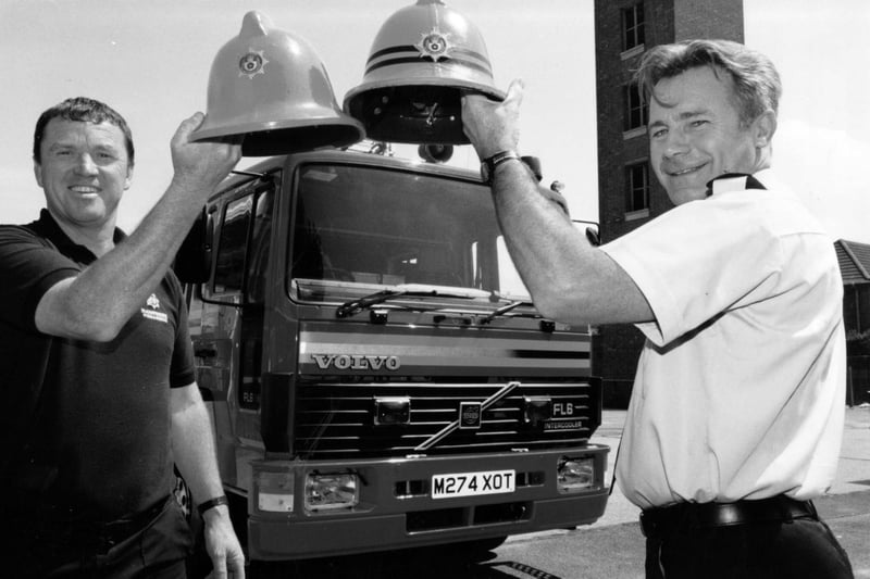 Christening their new £135,000 fire engine are firefighter Eddie Taylor (left) and sub officer Terry Goodard at the Forton Road station in Gosport, 1995. The News PP5742