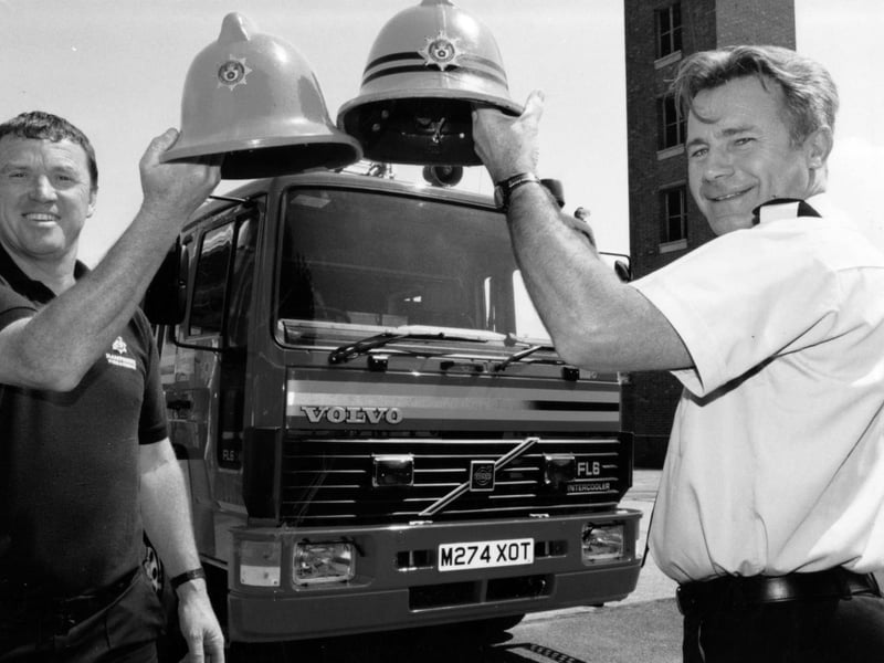 Christening their new £135,000 fire engine are firefighter Eddie Taylor (left) and sub officer Terry Goodard at the Forton Road station in Gosport, 1995. The News PP5742