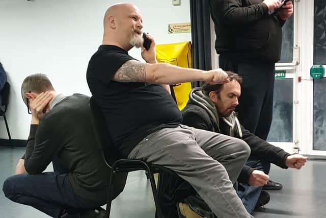 The cast of HumDrum's production of Dirk Gently's Holistic Detective Agency in rehearsal