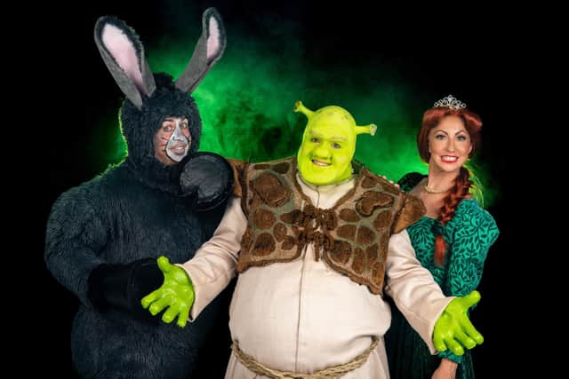 The Portsmouth Players present Shrek: The Musical at The Kings Theatre, Southsea from October 11-15, 2022. From left: Tom Wood as Donkey, Jack Edwards as Shrek, Lauren Kempton as Princess Fiona. Picture by Cinnabar Studios