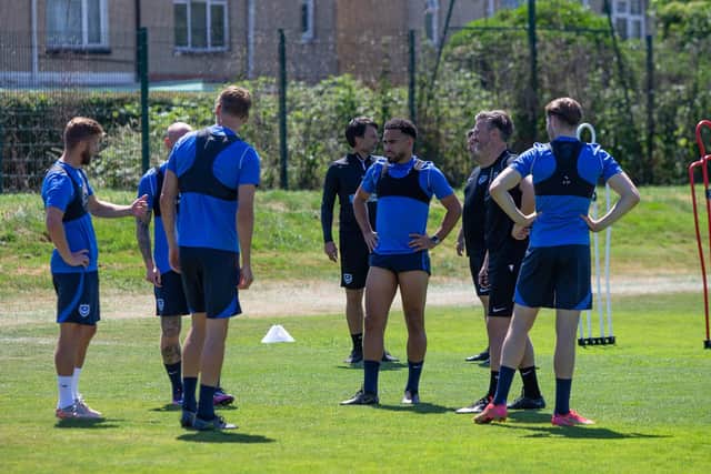 Michael Jacobs, Louis Thompson and assistant manager Nicky Cowley are pictured from last summer's start of pre-season training. They have since all left Pompey. Picture: Habibur Rahman