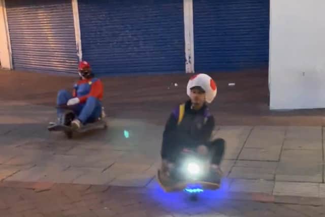 A still image of two of the fun-loving go-karters as they whizzed through Palmerston Road in Southsea. Picture: Daniel Balmbra