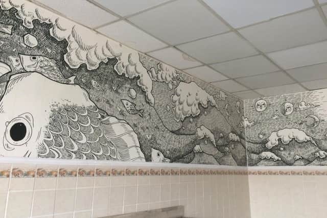 Vik Demjanova, 18 from Southsea, has been creating intricate murals on blank walls. Pictured: Vik's latest mural in Ocean Fresh Fish and Chips