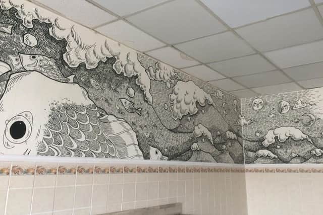 Vik Demjanova, 18 from Southsea, has been creating intricate murals on blank walls. Pictured: Vik's latest mural in Ocean Fresh Fish and Chips