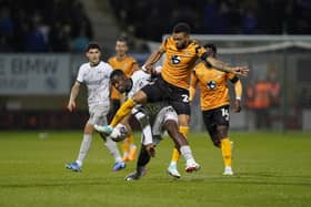 Christian Saydee battles with Cambridge United's Jordan Cousins in Pompey Abbey Stadium encounter. Picture: Jason Brown/ProSportsImages
