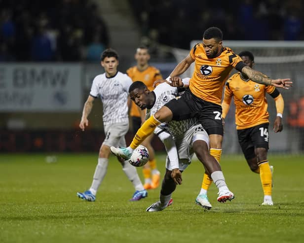 Christian Saydee battles with Cambridge United's Jordan Cousins in Pompey Abbey Stadium encounter. Picture: Jason Brown/ProSportsImages