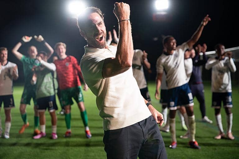 Joseph Fiennes (centre) plays England manager Gareth Southgate in the new BBC drama Dear England (Picture: BBC/Left Bank)