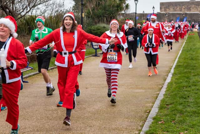 Runners undeterred by the weather start the Santa Fun Run at Southsea Castle. Picture: Mike Cooter (181222)