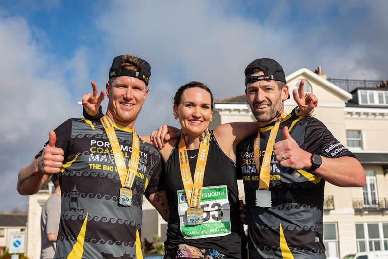 Neil Phipps (42) with sister-in-law Anna Willby-Lopez (42) and best mate Gary Stone (41) at the finish line of the Portsmouth Coastal Half Marathon. Picture: Mike Cooter (180224)