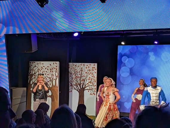 BSL interpreter on stage at the pantomime