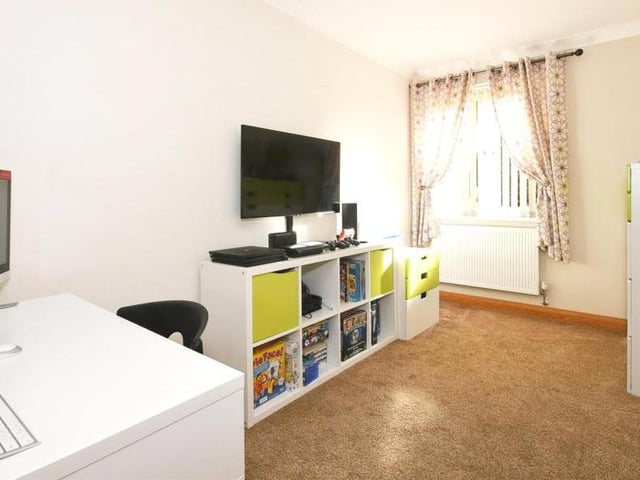 This compact ground-floor room is currently designated as a study. But it could easily be a playroom for the kids, converted into a fourth bedroom, or used as an office for you to work from home.