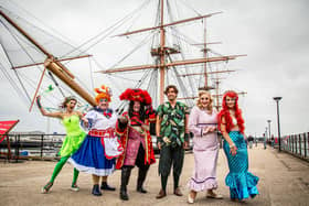 Pictured: Geogia Deloise, Jack Edwards, Shaun Williamson, James Argent, Elizabeth Rose and Julia Worsley near HMS Warrior at the Historic Dockyard, Portsmouth. Pictured is the cast on September 19 ahead of the launch of the Christmas pantomime at The Kings Theatre. Picture: Habibur Rahman