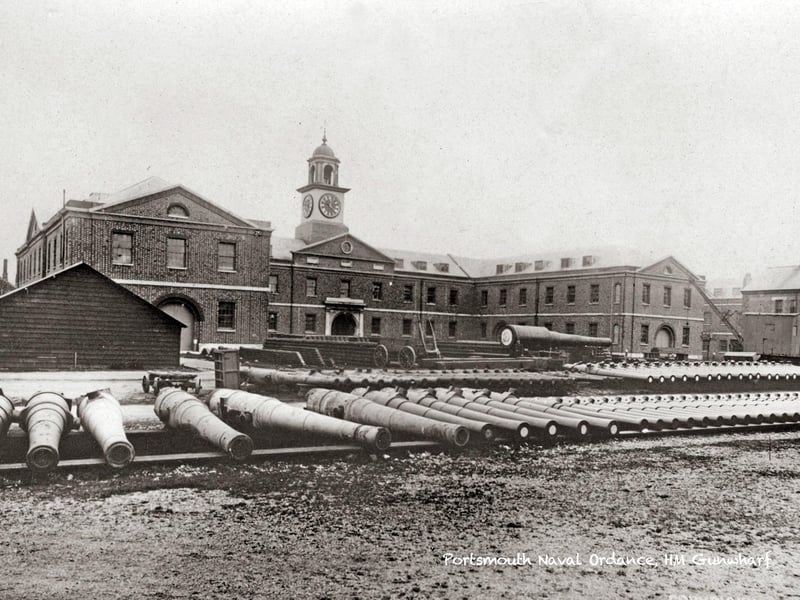 Here we see a photo taken inside Gunwharf years before it became a residential site. The building to the rear still stands as apartments and a studio. The massive guns and implements to the rear show what the location was used for before becoming HMS Vernon.