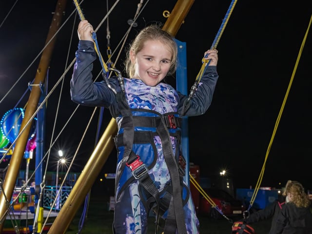 HMS Sultan held its annual bonfire and fireworks night on Thursday evening, as thousands of locals enjoyed all the fun of the fair.  Pictured - Esme, 8 enjoying the trampoline  Photos by Alex Shute