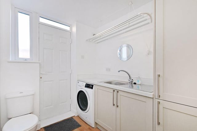 From the kitchen, a door opens into the utility room/downstairs WC with matching units, a cupboard which houses the combination boiler, a sink and a pulley maid for clothes drying. There is space and plumbing for a washing machine and a door which opens into the garden at the rear.