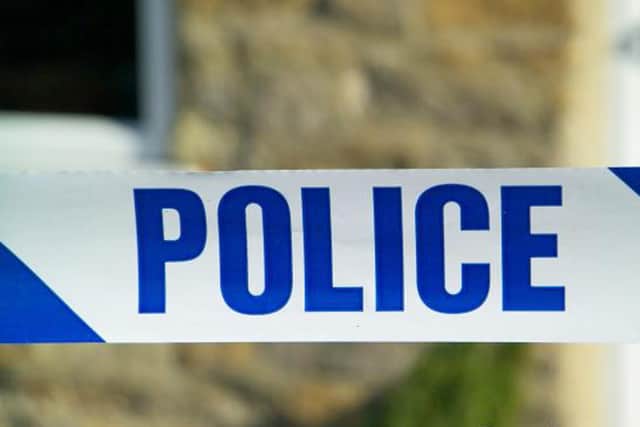The woman remains in custody