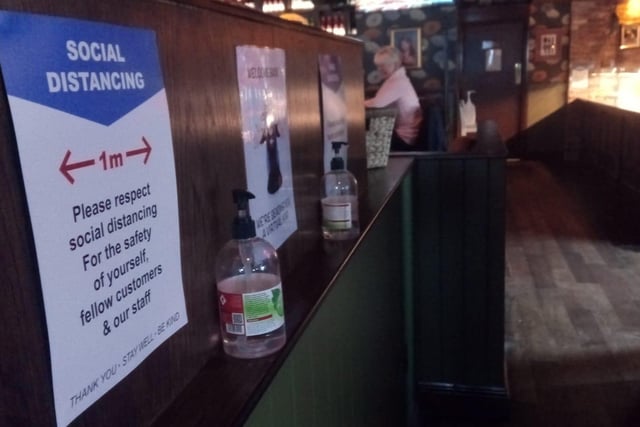 Signage explaining the social distancing rules to customers.
