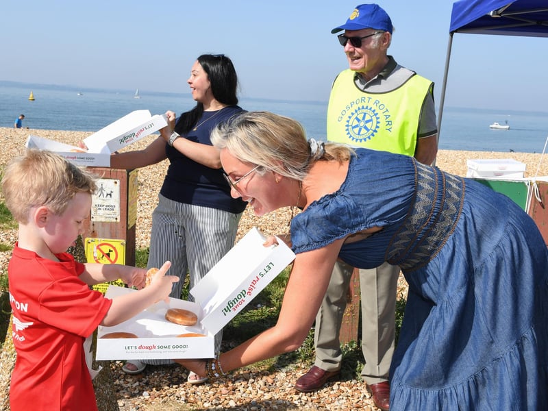 Gosport MP Dame Caroline Dinenage hands out doughnuts.
Credit: Paul Jacobs/pictureexclusive.com