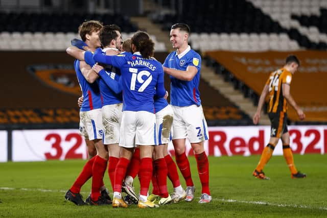 Callum Johnson celebrates with his team-mates as Pompey win 2-0 at Hull to top League One going into Christmas. Picture: Daniel Chesterton/phcimages.com