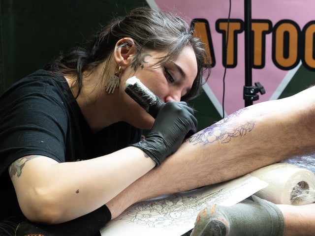 Pictured is: Kit Wagstaff works on the leg of Yohan
Picture: Keith Woodland (010421-60)