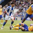 Former Pompey player and current Mansfield defender Callum Johnson is grounded as team-mate Lucas Akins and two Colchester opponents battle for possession in Sunday's heartbreaking finale. Picture: Steven Paston/PA Wire.